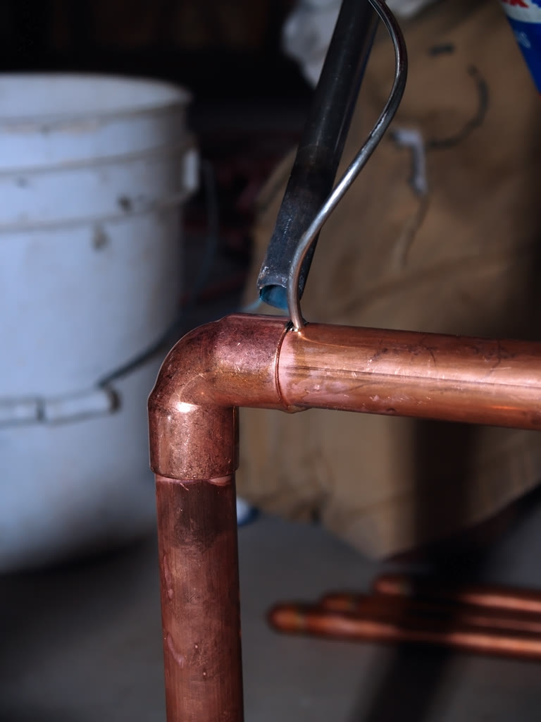Technician brazing a copper line set