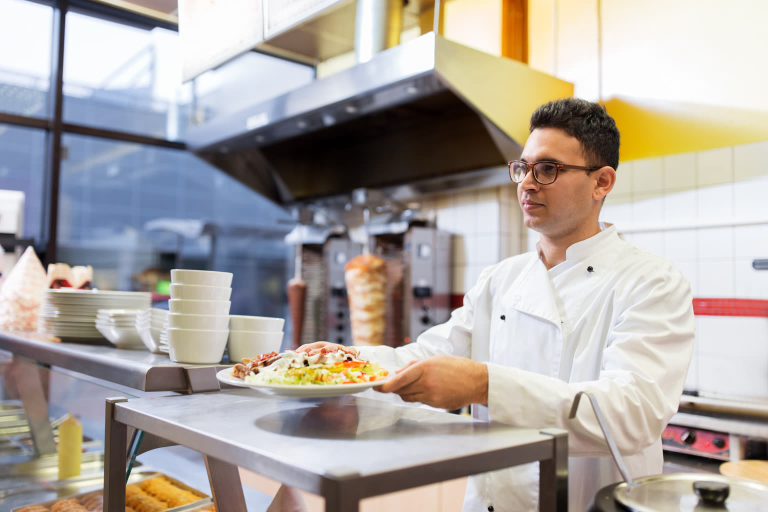 Cook working a busy restaurant line