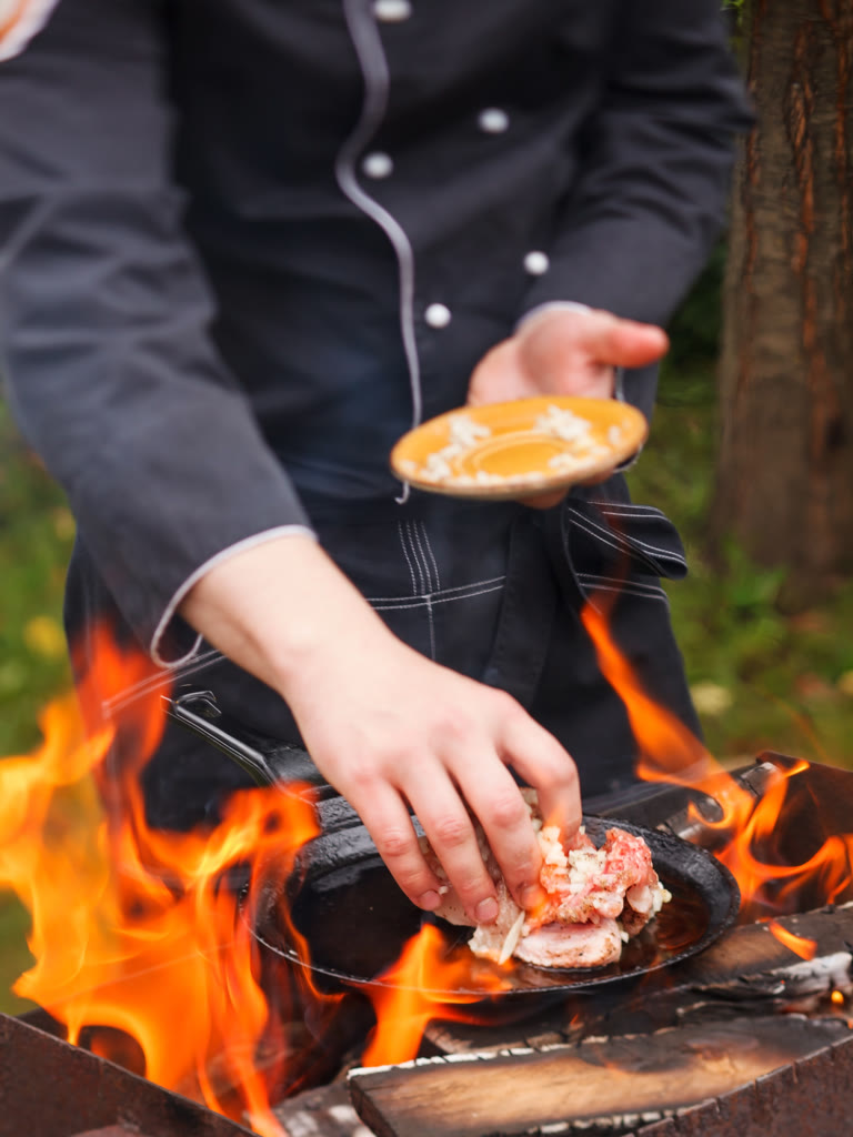 Cook plating on a busy kitchen line